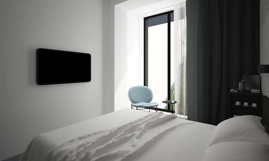 Golden Tulip Design Tbilisi Hotell Rum bild